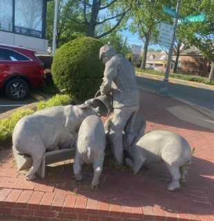 Art Walk - Man Stopping Pigs sculpture